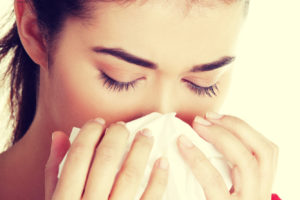 Women Sneezing
