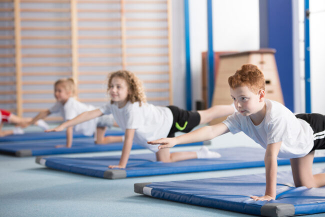 Children performing back exercise