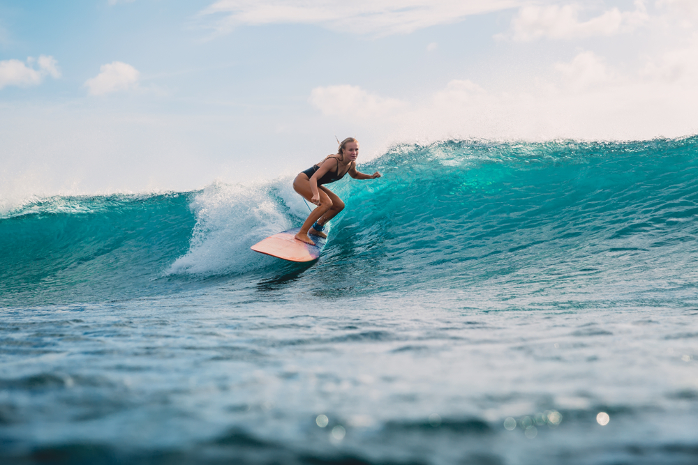 Women surfer, riding waves