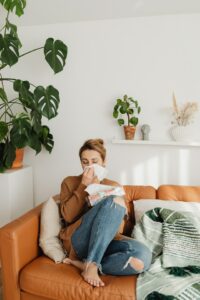Women on couch with handkerchief