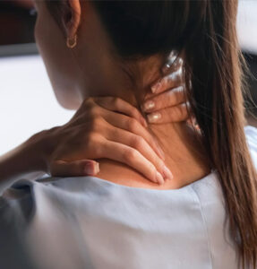 Woman having neck pain