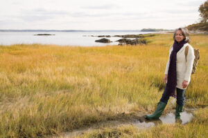 Women walking on a marsh
