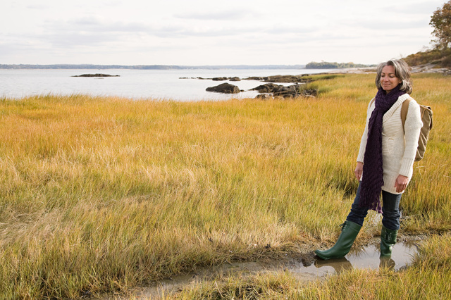 Women walking on a marsh