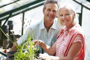 middle-aged-couple- smiling-working-together